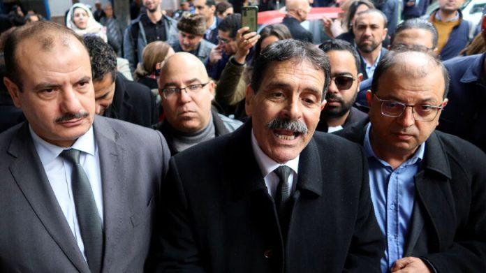 Tunisian prominent activist, Ayachi Hammami, speaks outside a court in Tunis