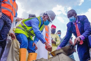 Former Governor of State of Osun, Alhaji Adegboyega Oyetola, during the foundation-laying ceremony of Minaret University in Ikirun on March 9, 2021, while other dignitaries’ watches. Photo credit: Dateline