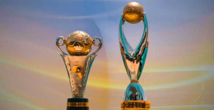 Image of the CAF Champions League and the CAF Confederation Cup trophies.