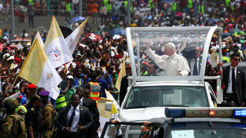 Pope Leo XIV in his Popemobile and waving the crowd 