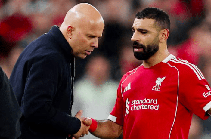 Liverpool manager Arne Slot (L) with Mohamed Salah (R).