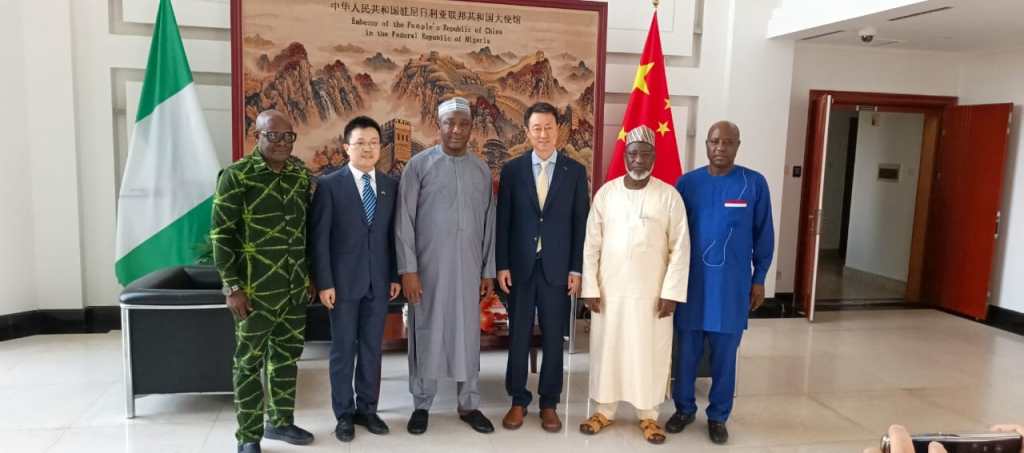 NFF’s Director of Media & Communications, Dr Ademola Olajire (L) with Chinese Embassy’s First Secretary, Ni Zhichen (second from left) and NFF President Ibrahim Gusau (third from left), with Chinese Ambassador to Nigeria, Yu Dunhai (third from right), NFF General Secretary, Dr Mohammed Sanusi; (second from right) and NFF’s Director of Protocol, Barnabas Joro (right).