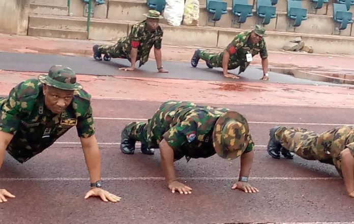 Image of Nigerian soldiers exercising during Armed Forces’ Annual 5-kilometre Route March in Abuja, Nigeria.