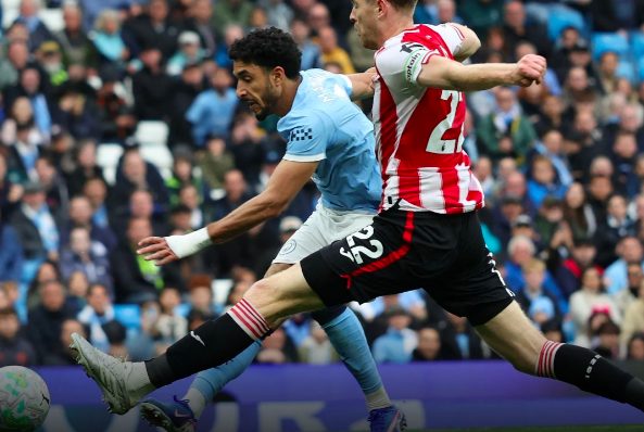 Egyptian Omar Marmoush scores against Brentford.