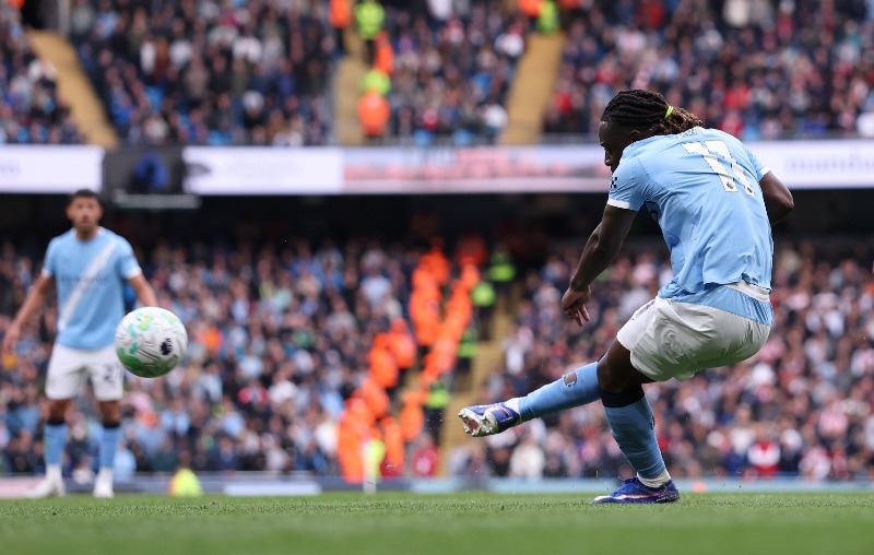 Manchester City winger, Jeremy Doku, scores goal.