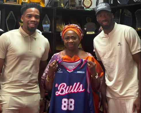 The Chairman/CEO of the Nigerians in Diaspora Commission, Dr. Abike Dabiri-Erewa (c) with Nigerian basketball star Ejimofor Anosike.