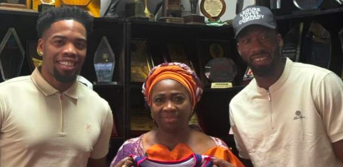 The Chairman/CEO of the Nigerians in Diaspora Commission, Dr. Abike Dabiri-Erewa (c) with Nigerian basketball star Ejimofor Anosike.