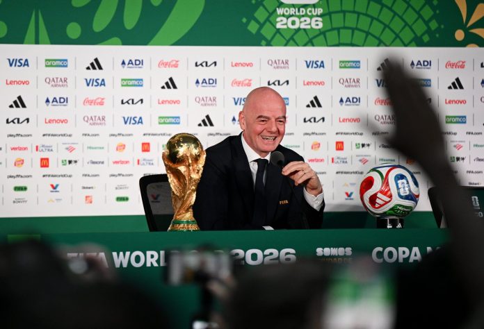 FIFA president Gianni Infantino with the 2026 FIFA World Cup trophy and match ball.
