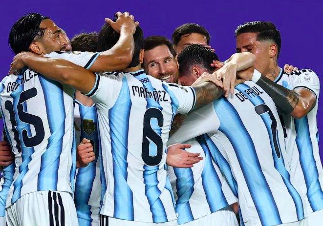 Argentina's Lionel Messi celebrates goal with teammates.