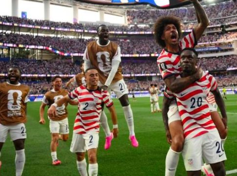 United States striker Folarin Balogun celebrates goal against Paraguay with teammates during 2026 FIFA World Cup encounter.