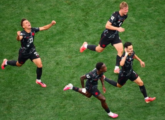 Canada's Stephen Eustaquio celebrates goal with teammates.