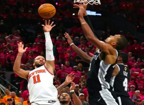 New York Knicks star, Jalen Brunson (11) takes shot during NBA Finals game against the San Antonio Spurs.