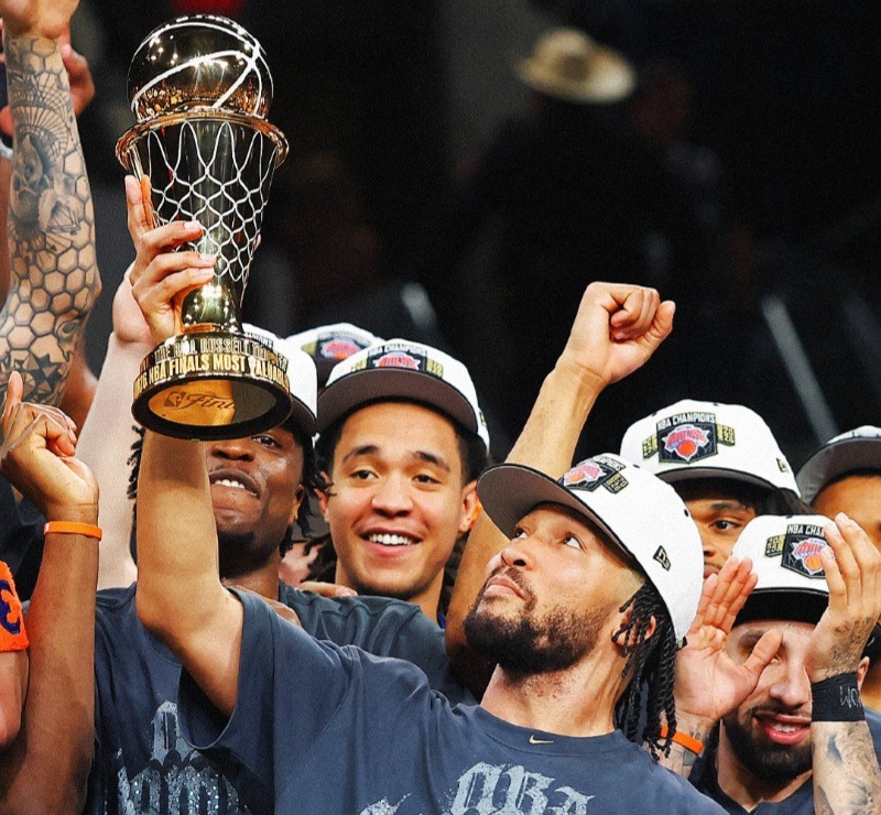 Knicks star Jalen Brunson with the Finals Most Valuable Player award.