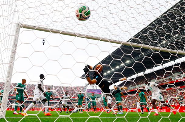 The ball deflects off Habib Diarra and into the net to give Senegal the lead