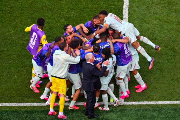 France forward Ousmane Dembélé celebrates goal with teammates.