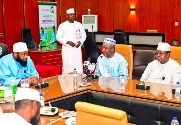 Governor Umaru Bago of Niger State (L) with Nigeria Football Federation (NFF) president, Ibrahim Gusau (C).