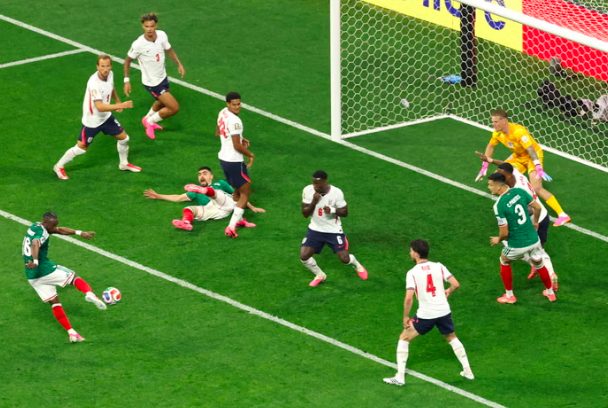Mexico's Julian Quinones scores against England