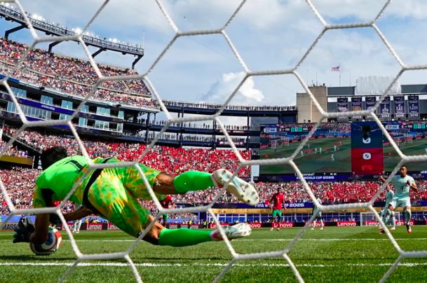 Morocco goalkeeper Yassine Bounou saves penalty from Kylian Mbappe.
