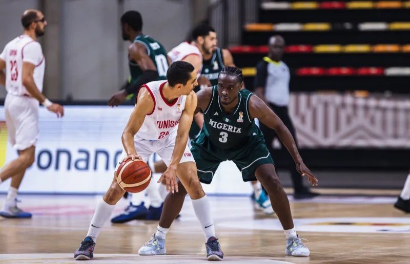 Action during 2027 FIBA Basketball World Cup African Qualifier between D'Tigers of Nigeria and Tunisia in Luanda, Angola.