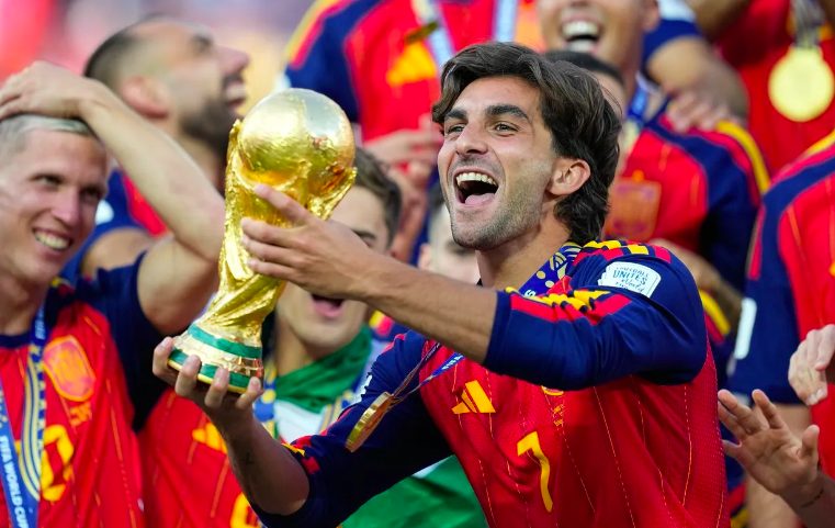 Spain forward Ferran Torres with World Cup trophy.