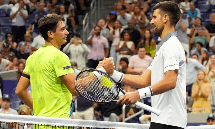 Argentina's Mariano Navone (L) shakes hands with Serbia's Novak Djokovic (R).