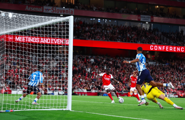 Arsenal's Bukayo Saka scores.