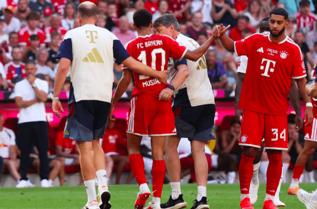 Bayern Munich's Jamal Musiala walks off the pitch to be substituted after collapsing.2