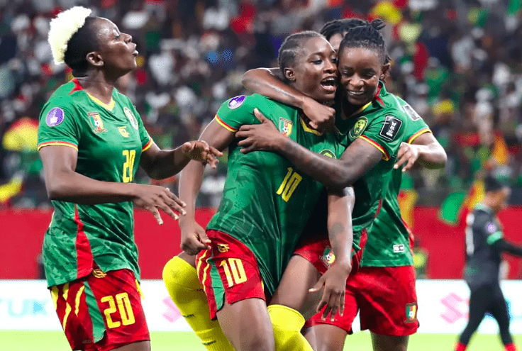 Cameroon's Marie Ngah celebrates second goal with teammates.