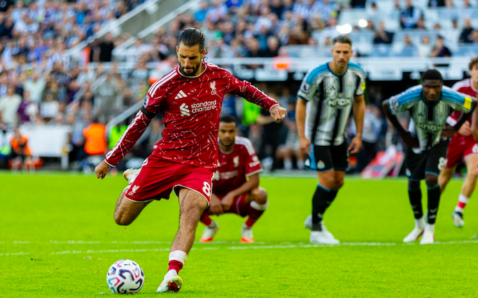 Liverpool midfielder Dominic Szoboszlai scores penalty.