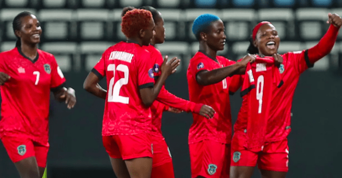 Malawi's senior women's football team celebrate victory against Ghana.