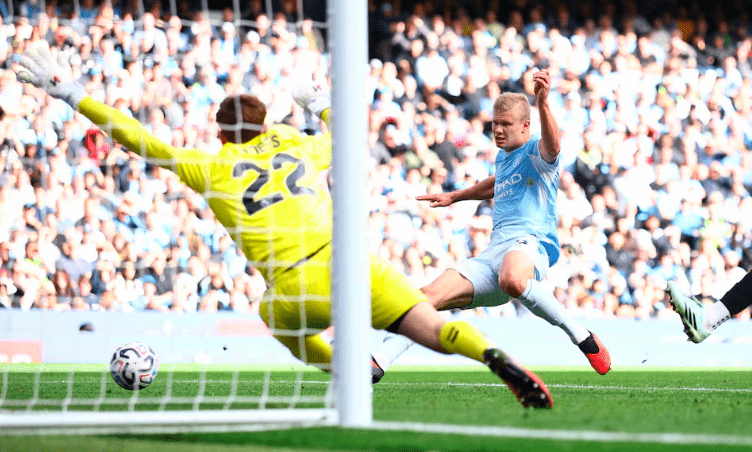 Manchester City striker Erling Haaland scores.