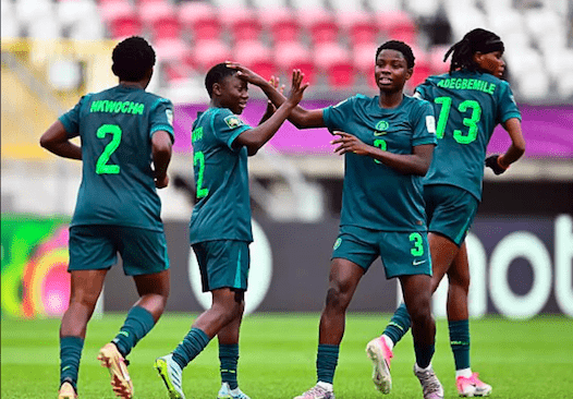Nigeria's Tosin Rafiu (12) celebrates goal with teammates.